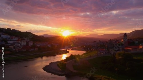 Enchanting Sunset Over a Vibrant Cityscape with Lush Hills and a Winding River