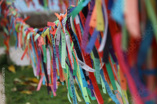 Vibrant Array of Colorful Ribbons Tied to a String: Festive and Decorative Display photo