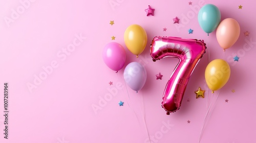 An elegant balloon in the shape of the number seven displays prominently against a pink background, perfect for a birthday party photo