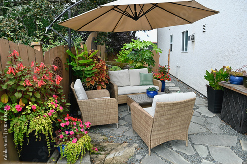 Outdoor mediterranean styled garden patio cafe space landscaped backyard seasonal oasis. 