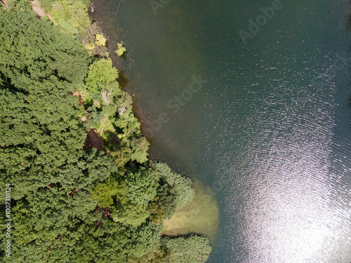 Aerial top down of Krumme Lanke Lake during summer in Grunewald Forest in West Berlin photo