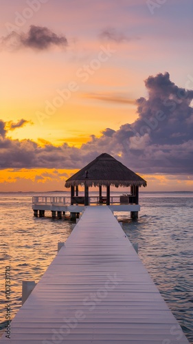 Serene seascape at sunset with a pier leading to a hut Vertical Mobile Wallpaper