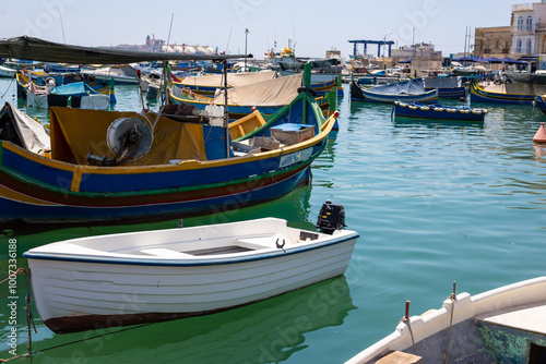 Wallpaper Mural Small boat tied in a dock in the fisherman's village of Marsaxlokk, in Malta Island, Mediterranean Sea Torontodigital.ca