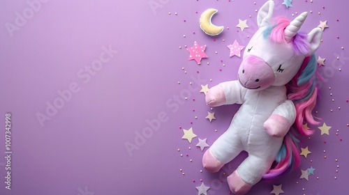 Plush unicorn toy with stars and moon on a purple background. Minimalist flat lay composition with copy space for children's products, nursery decor, and birthday banners.