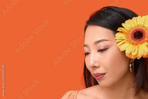 Young asian woman with yell...