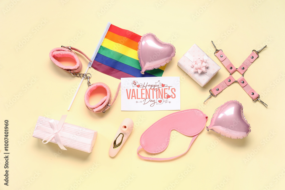Fototapeta premium Festive postcard with sex toys, gifts and rainbow LGBT flag on yellow background. Valentine's Day celebration