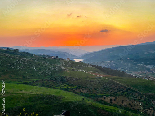 Sunset Over Mountains and Lake