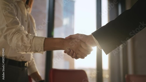 Business partners handshake showing collaboration success