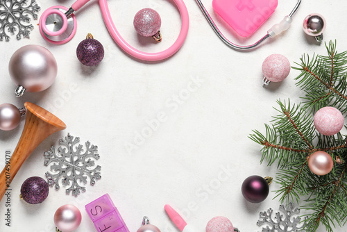 Frame made of Christmas decorations and medical supplies on light background