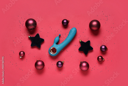 Composition with vibrator and different Christmas decorations on color background