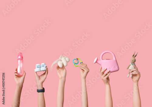 Female hands with baby toys...