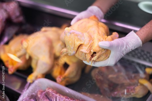 Inside refrigerated display, selection of poultry products is neatly presented. photo