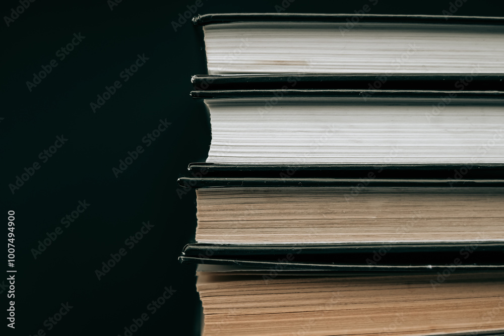 Books about mysticism and esotericism.Stack of books.Books with black covers on a black background. Reading books. Reading and education.Learning and knowledge symbol. Books about mysticism and esotericism.Stack of books.Books with black covers on a black background. Reading books. Reading and education.Learning and knowledge symbol.