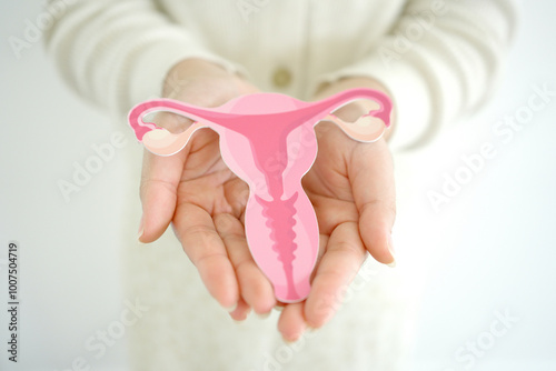 woman holding uterus, female reproductive system , woman health, PCOS, gynecologic and cervix cancer concept
