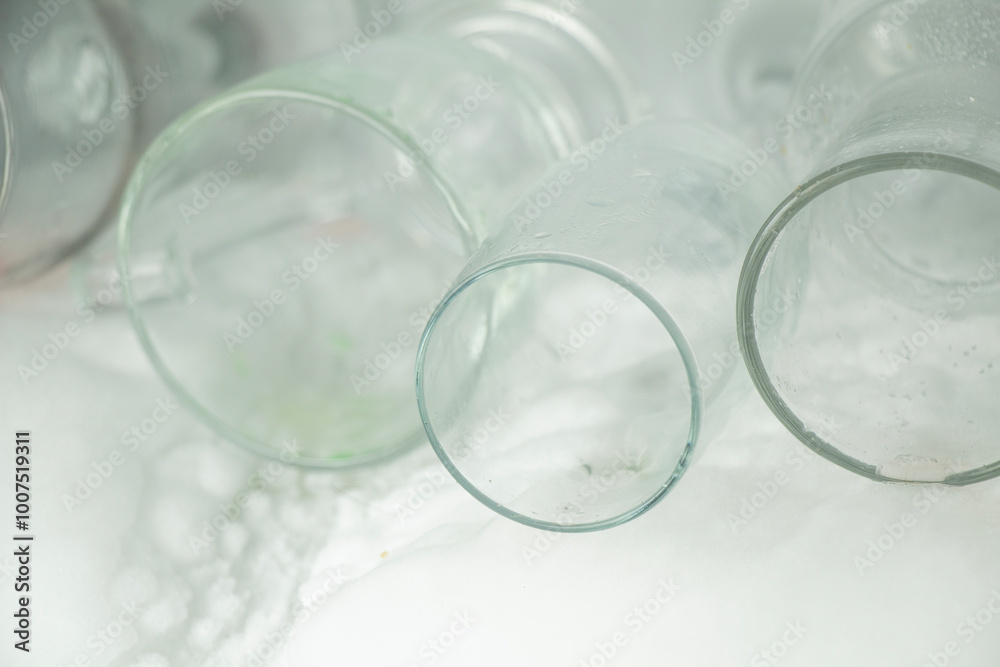 several empty glasses were stacked on top of each other in the refrigerator several empty glasses were stacked on top of each other in the refrigerator