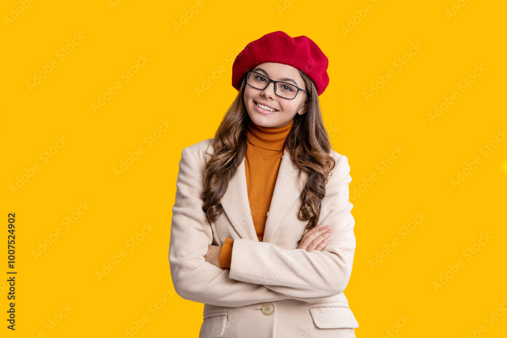 Trendy and stylish girl. Autumn teen girl wearing in glasses and beret. Fall season. Girl looks stylish in fall. Autumn mood of adolescent model. Autumn fashion girl isolated on yellow. Happy season Trendy and stylish girl. Autumn teen girl wearing in glasses and beret. Fall season. Girl looks stylish in fall. Autumn mood of adolescent model. Autumn fashion girl isolated on yellow. Happy season