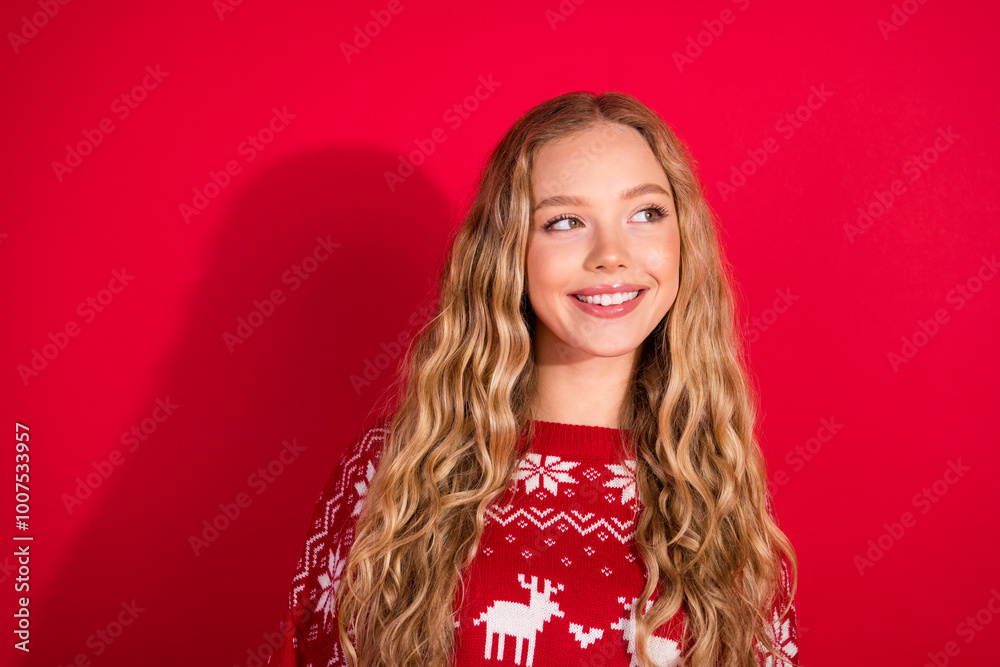Portrait of nice young girl look empty space wear xmas new year sweater isolated on bright red color background Portrait of nice young girl look empty space wear xmas new year sweater isolated on bright red color background