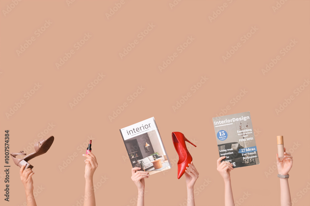 Female hands with different magazines, high heels, lipstick and makeup foundation on brown background Female hands with different magazines, high heels, lipstick and makeup foundation on brown background