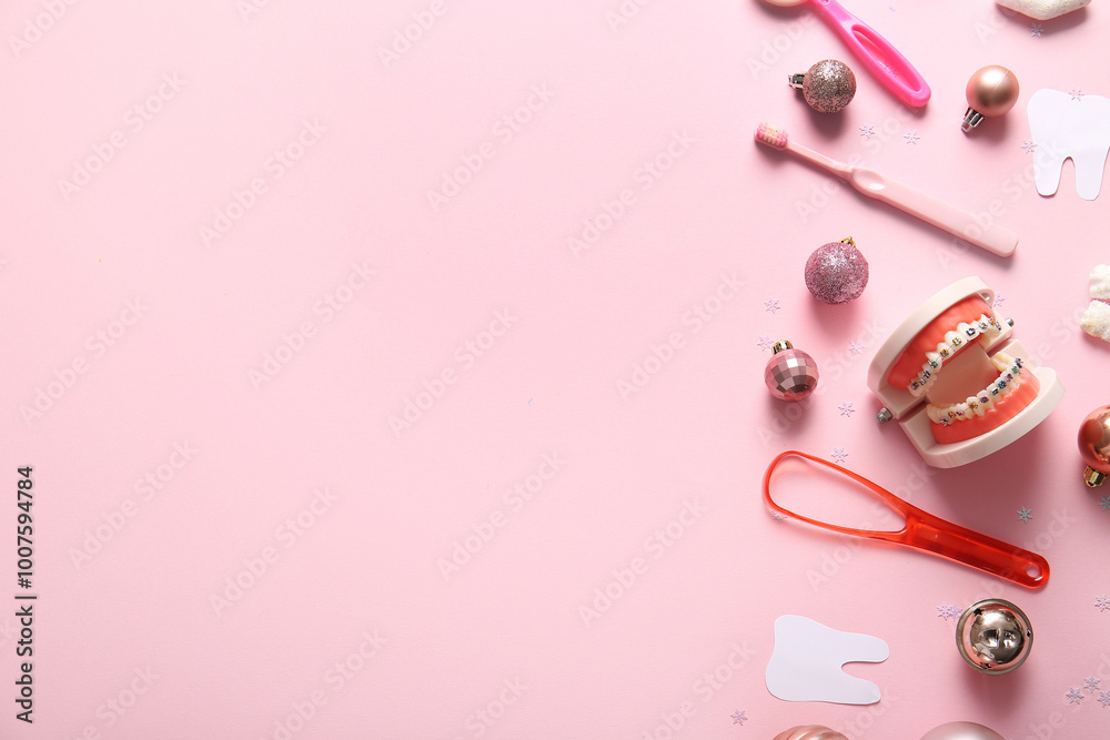 Composition with dentist's tools, paper teeth and Christmas decorations on pink background Composition with dentist's tools, paper teeth and Christmas decorations on pink background