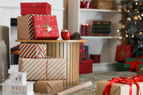 Many Christmas gift boxes with packing supplies and decorations on floor at home