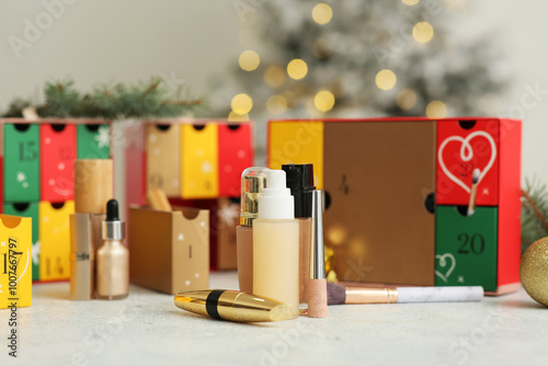 Wallpaper Mural Makeup products with Christmas Advent calendar on table against blurred lights, closeup Torontodigital.ca