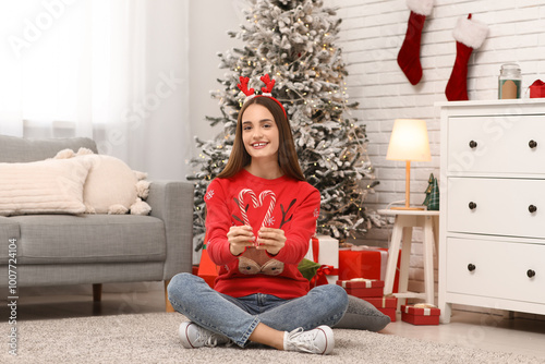 Young woman in sweater with...