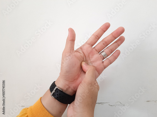 do finger stretches. and determine the points that cause disease on the hands photo