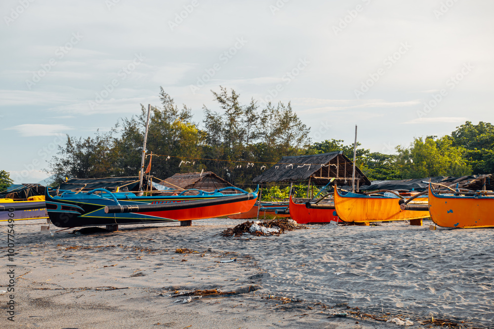 Beautiful fine white sand beach with fishing boats at the shore. Beautiful fine white sand beach with fishing boats at the shore.