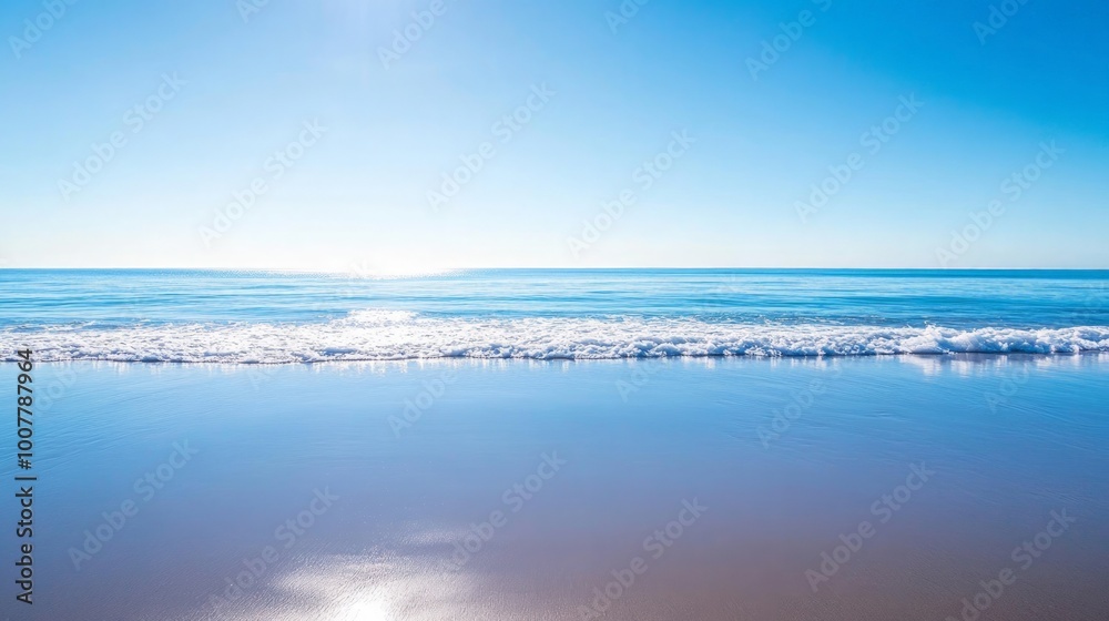 Obraz premium Tranquil Seascape, a serene sea mirroring a clear blue sky, gentle waves caressing the shore, creating an atmosphere of peace and relaxation, ideal for calming settings.