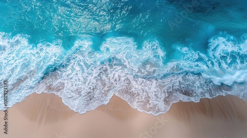 Aerial view of waves crashing on sandy beach