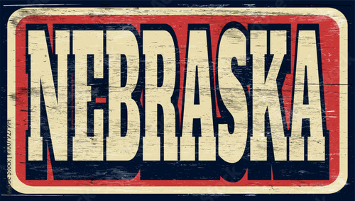 Aged vintage Nebraska sign on wood