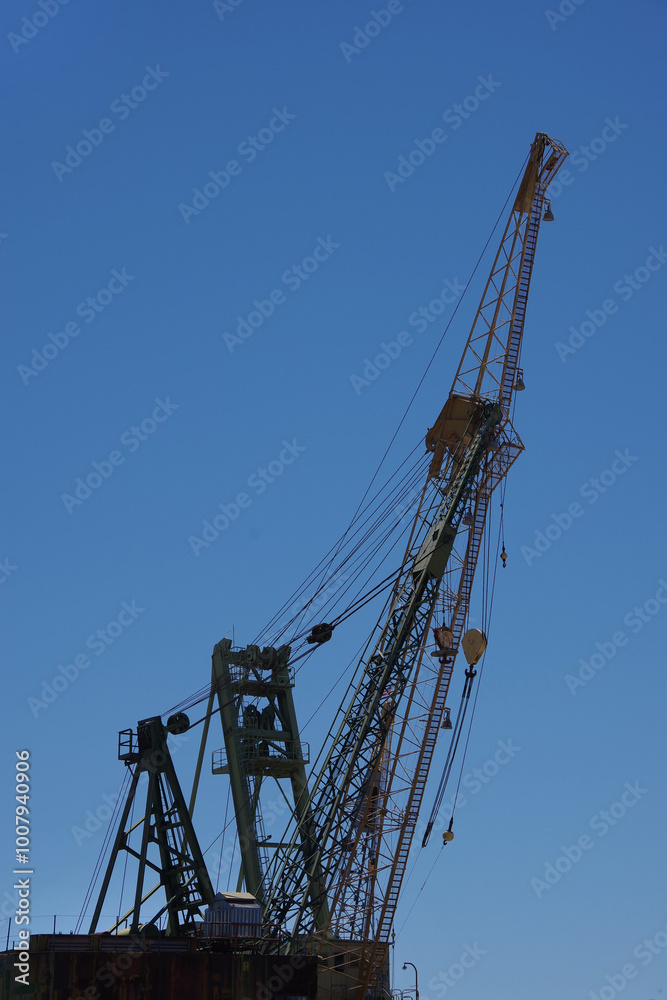 Cranes and huge metal structures at an old defunct shipyard Cranes and huge metal structures at an old defunct shipyard