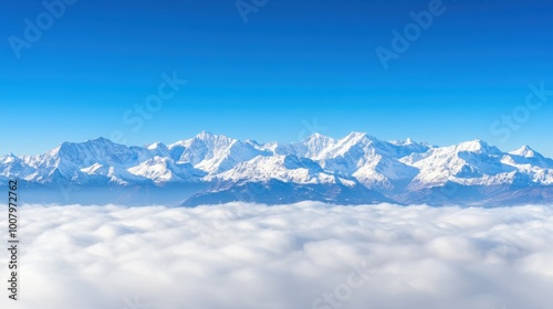 Panoramic View of Snow-Capped Mountains Under Blue Sky