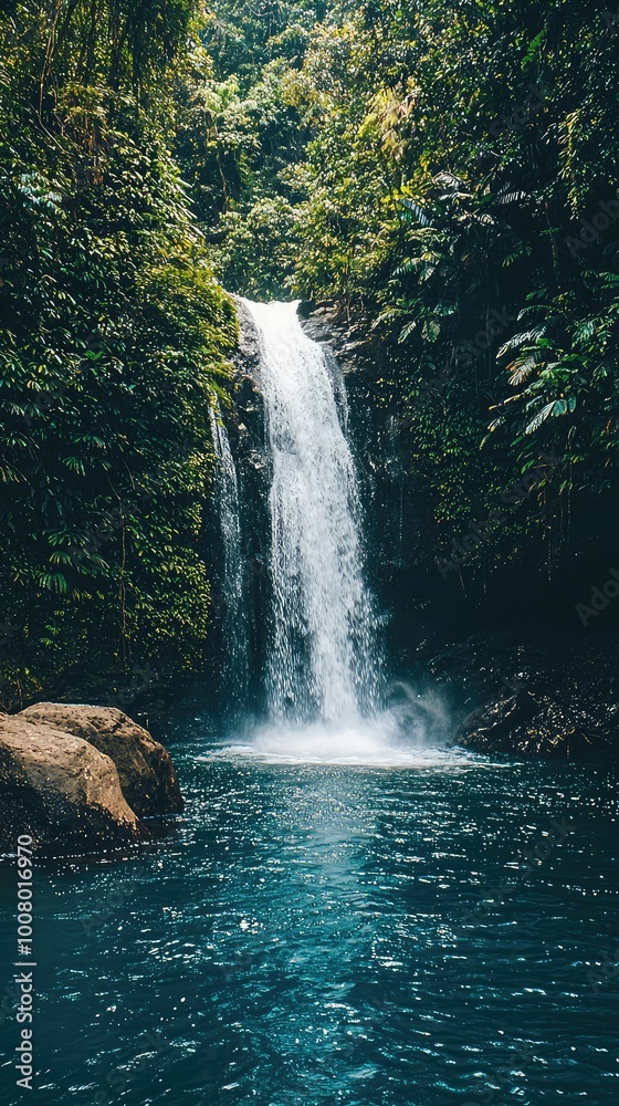 A serene waterfall cascading into a crystal-clear pool surrounded by lush greenery, perfect for nature lovers and tranquility seekers. A serene waterfall cascading into a crystal-clear pool surrounded by lush greenery, perfect for nature lovers and tranquility seekers.