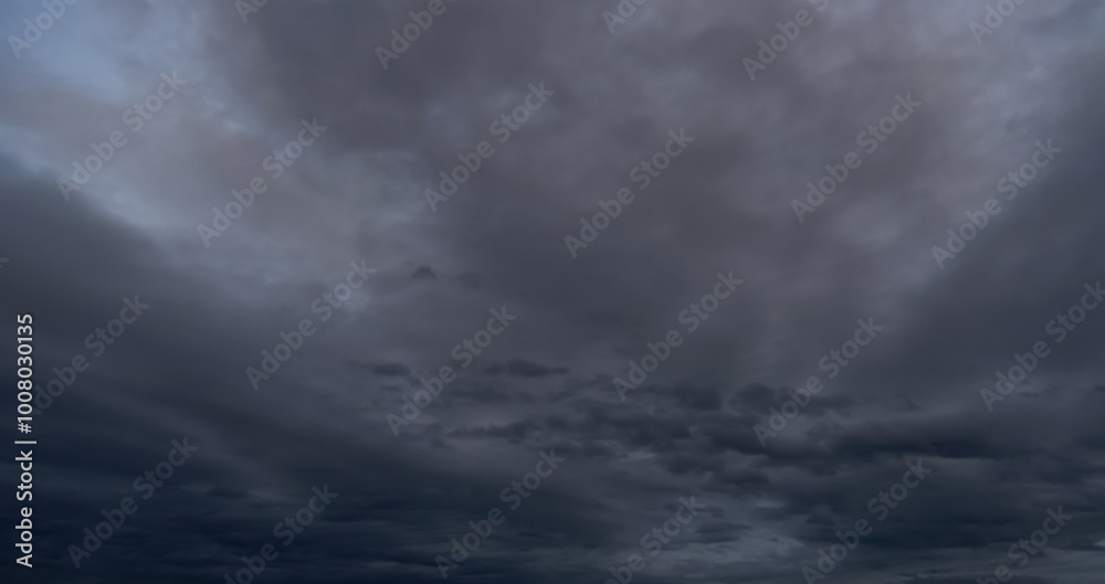 Dark sky with stormy clouds. Dramatic sky rain,Dark clouds before a thunder-storm. Dark sky with stormy clouds. Dramatic sky rain,Dark clouds before a thunder-storm.