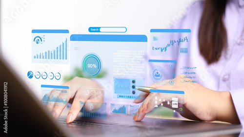 Businesswoman using computer for development and Analytics Data technology management System for report marketing strategy planning. graph analysis and information on a futuristic virtual screen.