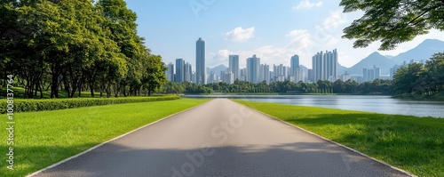 Asphalt road running alongside a lake garden, with tall city skyscrapers standing majestically in the background, blending nature and urban life