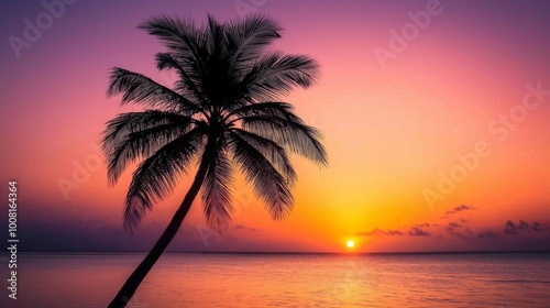 Silhouetted Palm Tree Against Vibrant Sunset Over Ocean