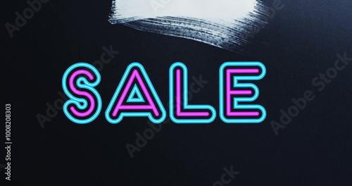 Image of sale text in pink and blue over white brush strokes on black