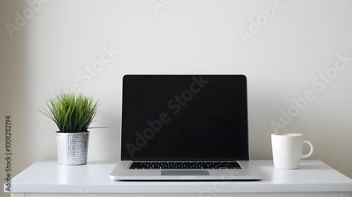 100. A sleek white desk with a laptop, a small decorative plant, and a cup of coffee, positioned in a bright, peaceful room