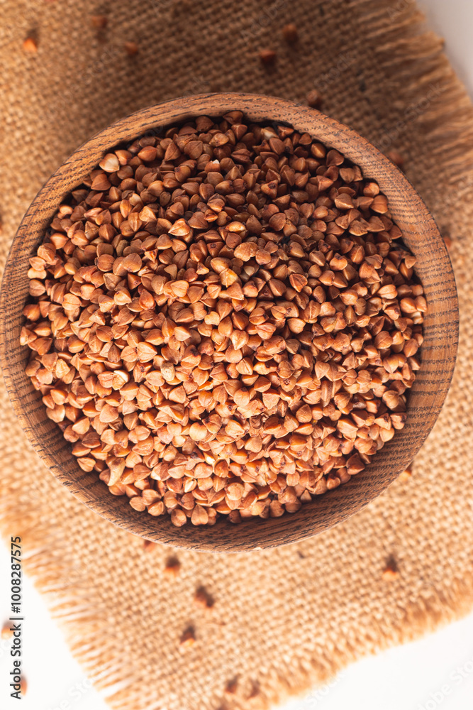 Buckwheat groats on wooden background. Healthy cereal concept Buckwheat groats on wooden background. Healthy cereal concept