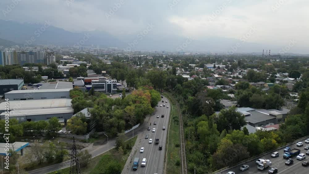 Almaty, Kazakhstan - 10.02.2024 : Traffic on one of the lines of road interchanges. The view from the drone. Almaty, Kazakhstan - 10.02.2024 : Traffic on one of the lines of road interchanges. The view from the drone.