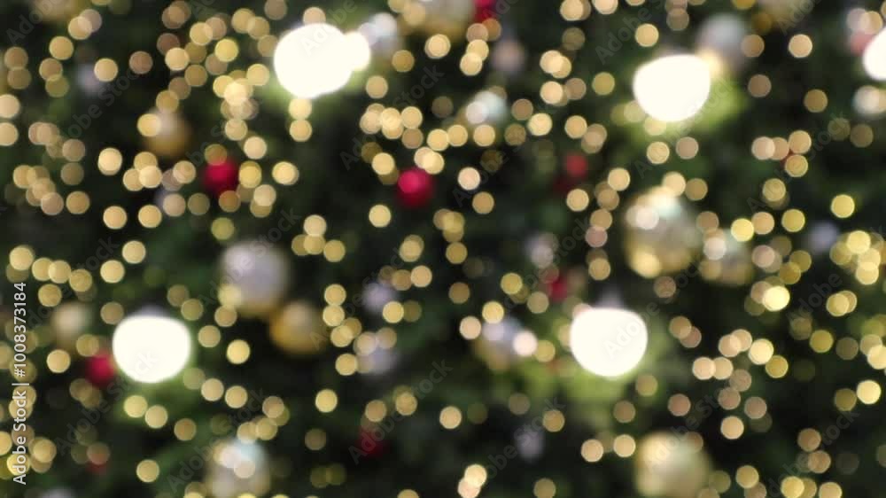 Abstract christmas holiday with festive gold bokeh light on tree blurred background