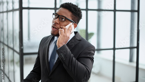 Close-up photo man outside an office building talking on the phone