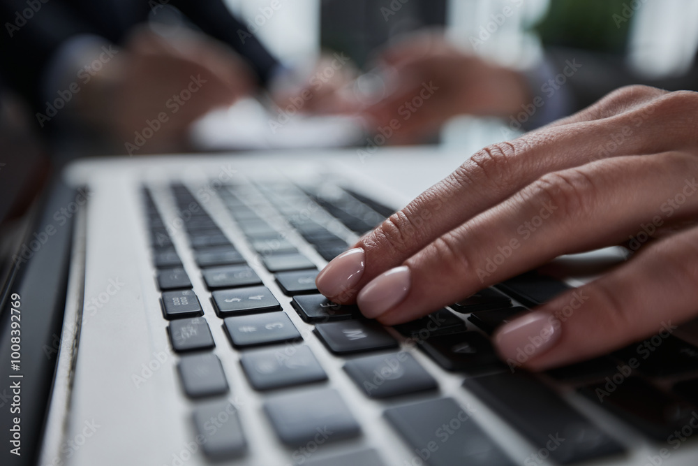 man's hands typing on laptop keyboard in interior man's hands typing on laptop keyboard in interior