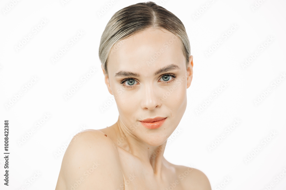 A beautiful model with flawless, fresh skin stands against a white background. This image highlights the significance of skincare and showcases a concept for cosmetic advertising.