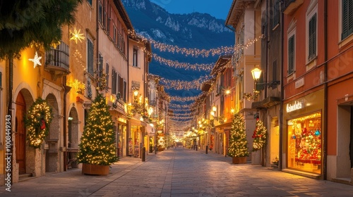 Fototapeta Naklejka Na Ścianę i Meble -  Nighttime in Riva del Garda, with the streets glowing under festive Christmas lights, the town center bathed in warm holiday colors and twinkling decorations.