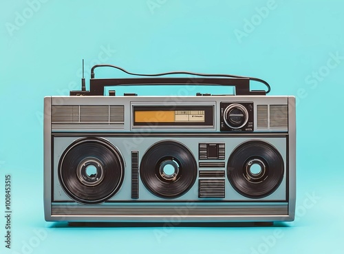 Vintage old-school gray boombox with a cassette tape player on a light blue background, evoking a retro vibe. Retro filters create a nostalgic effect