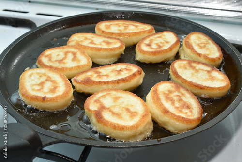 Photos Fried pancakes in the frying pan. High quality photo