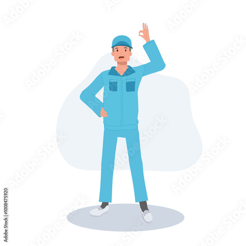 Male Janitor in Blue Uniform with OK Hand Sign. Male Cleaner in Blue Uniform Giving OK Gesture